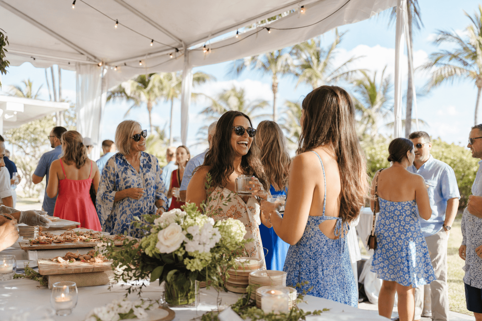 Outdoor community fundraising event under a tent