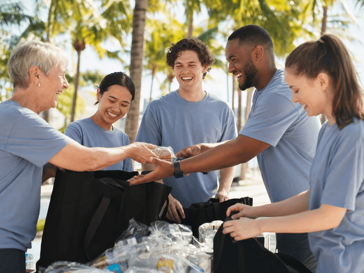 Volunteers assembling care packages outdoors